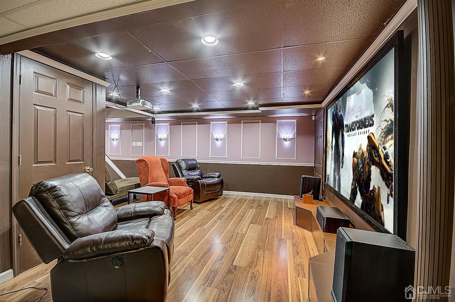 51 Timber Ridge Road North Brunswick, NJ 08902 - Photo 48 of 57 a media room with lots of chairs and a projector screen