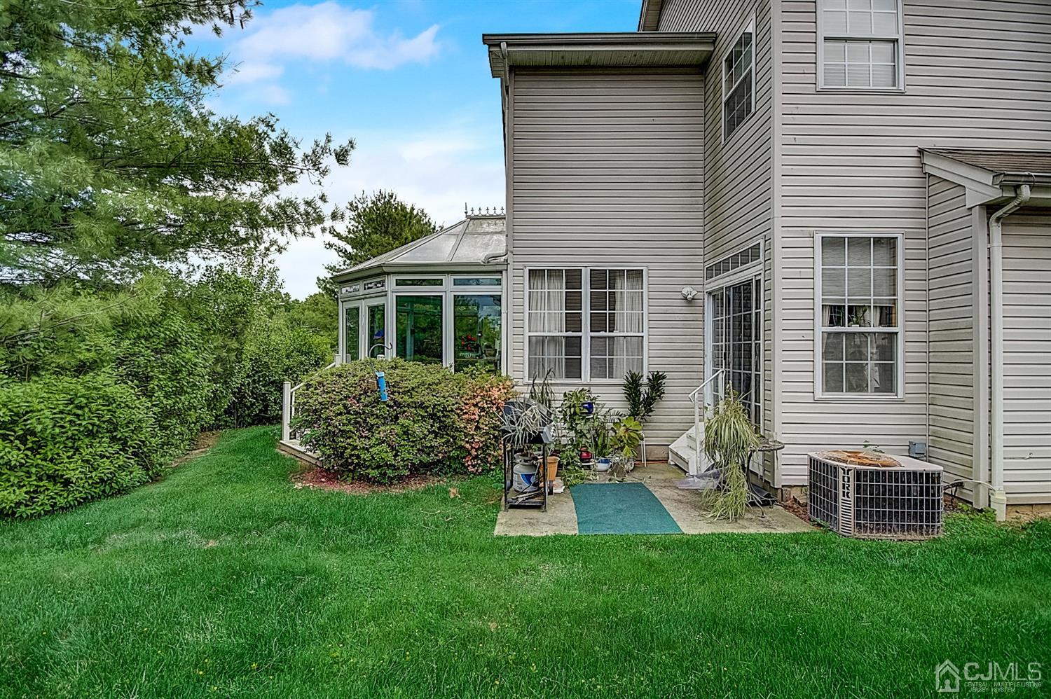 51 Timber Ridge Road North Brunswick, NJ 08902 - Photo 51 of 57 a house with garden in front of it