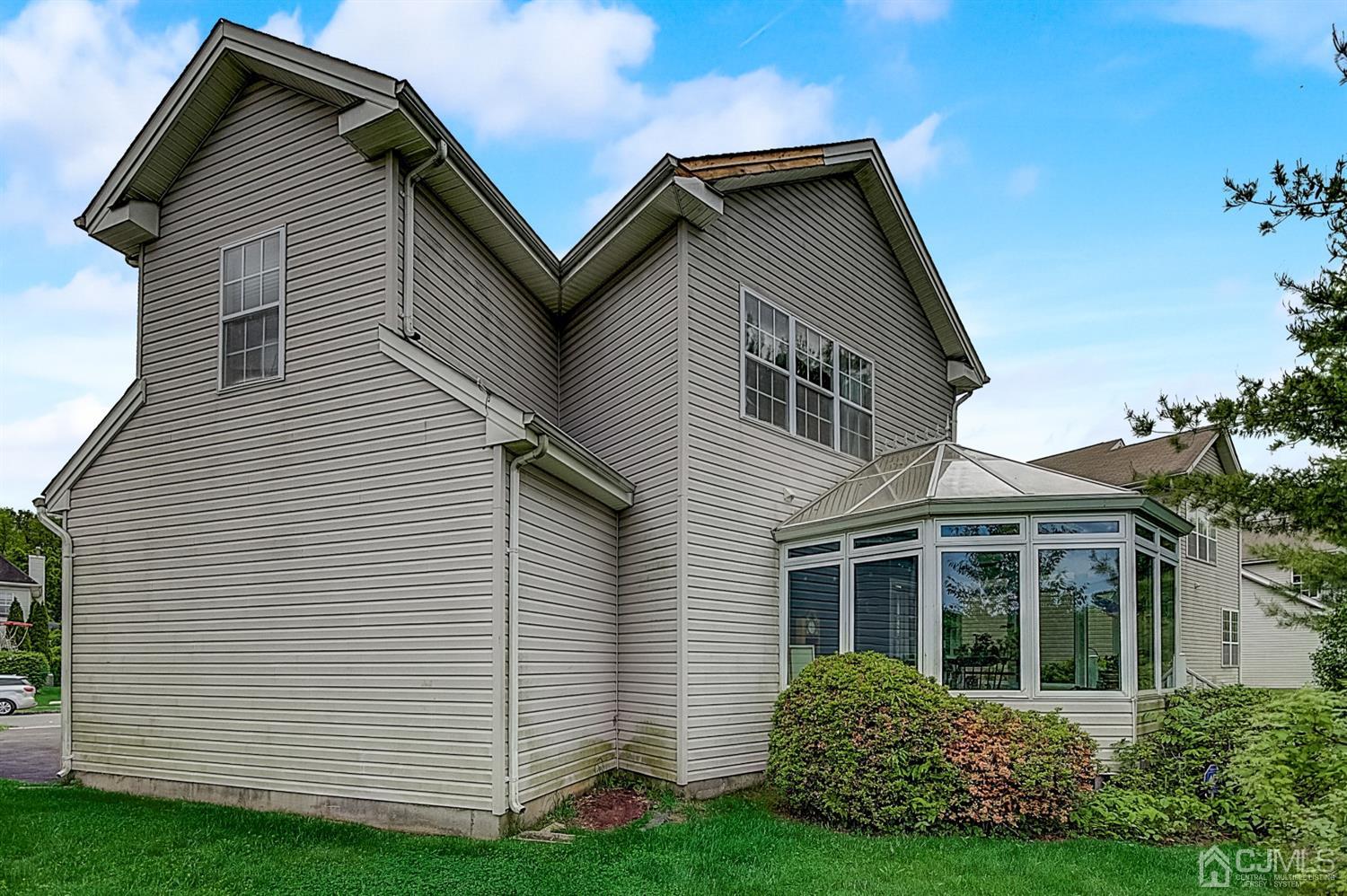 51 Timber Ridge Road North Brunswick, NJ 08902 - Photo 53 of 57 a front view of a house with a yard