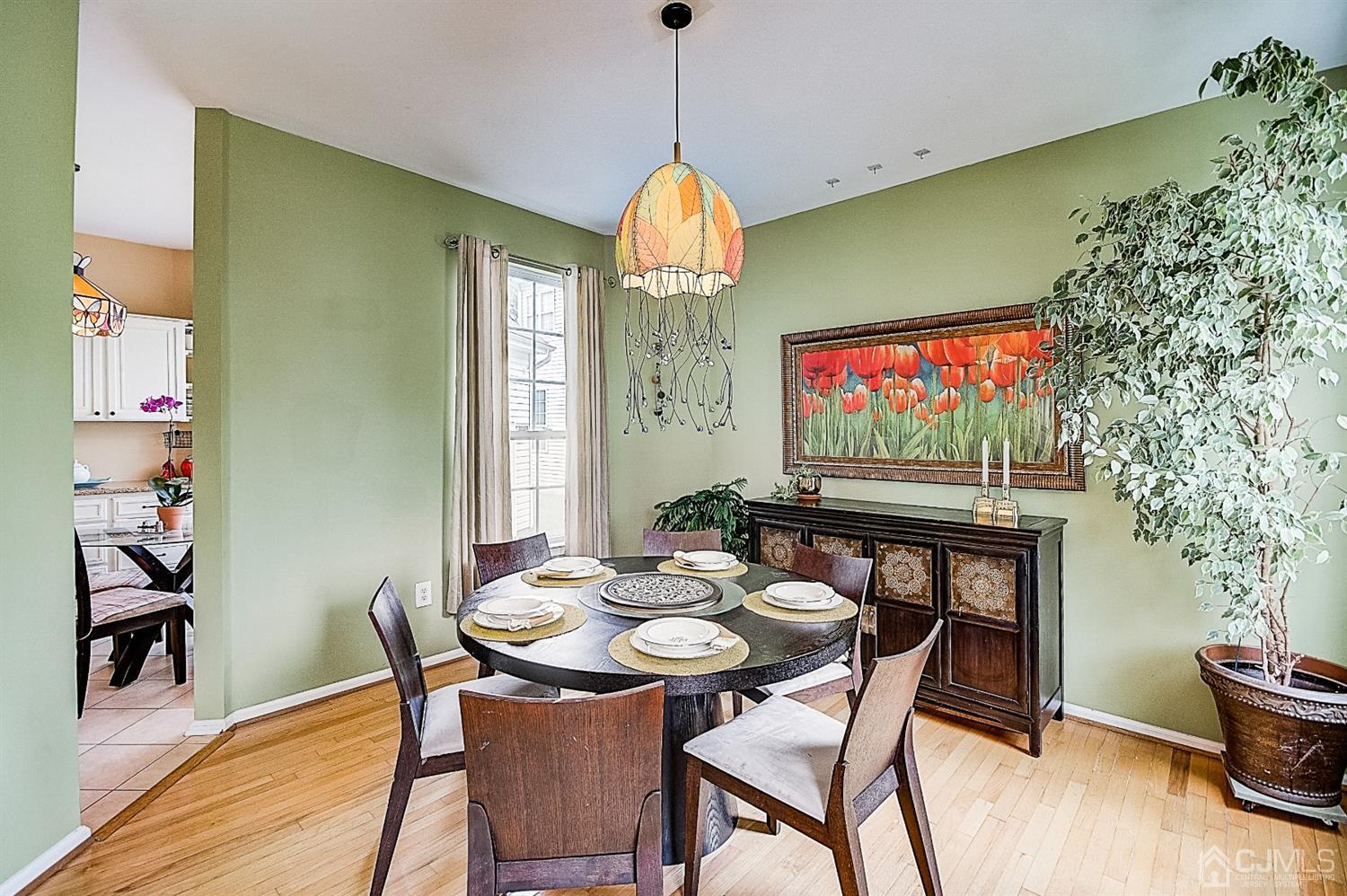 51 Timber Ridge Road North Brunswick, NJ 08902 - Photo 9 of 57 a view of a dining room with furniture wooden floor and a chandelier