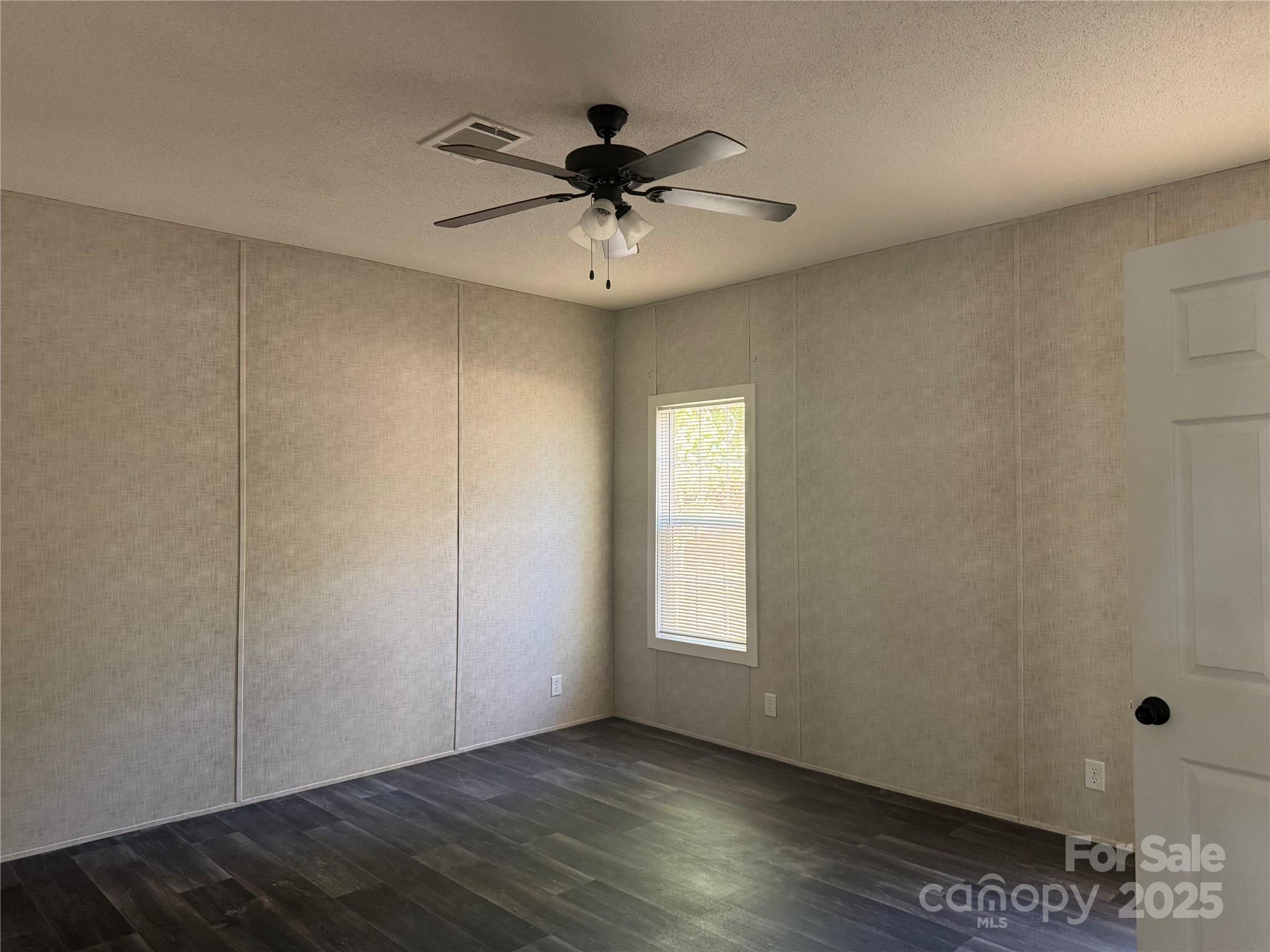 3960 State Rd S-28-414 Kershaw, SC 29067 - Photo 12 of 20 wooden floor in an empty room with a window