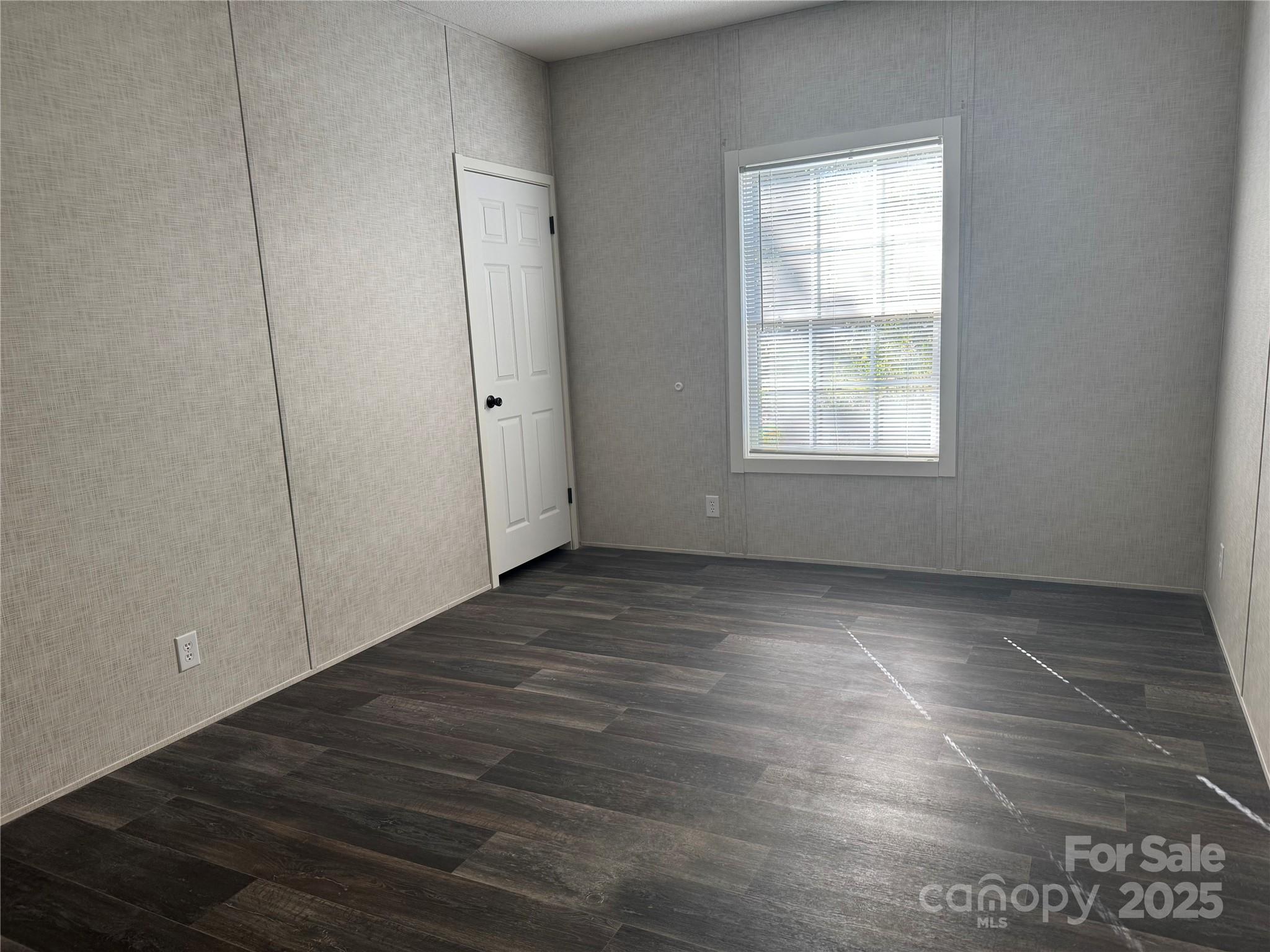 3960 State Rd S-28-414 Kershaw, SC 29067 - Photo 18 of 20 an empty room with wooden floor and windows