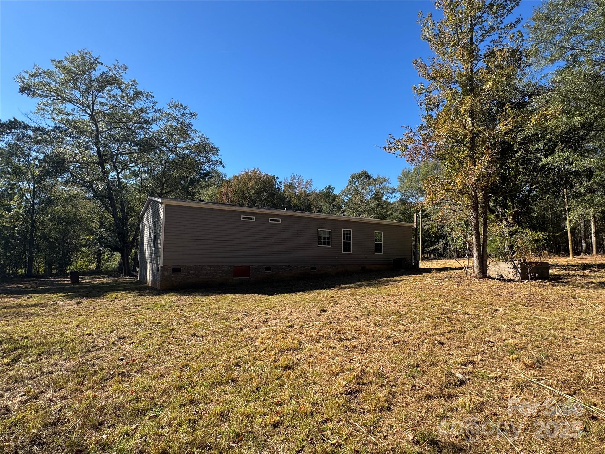 3960 State Rd S-28-414 Kershaw, SC 29067 - Photo 2 of 20 a street view with wooden fence