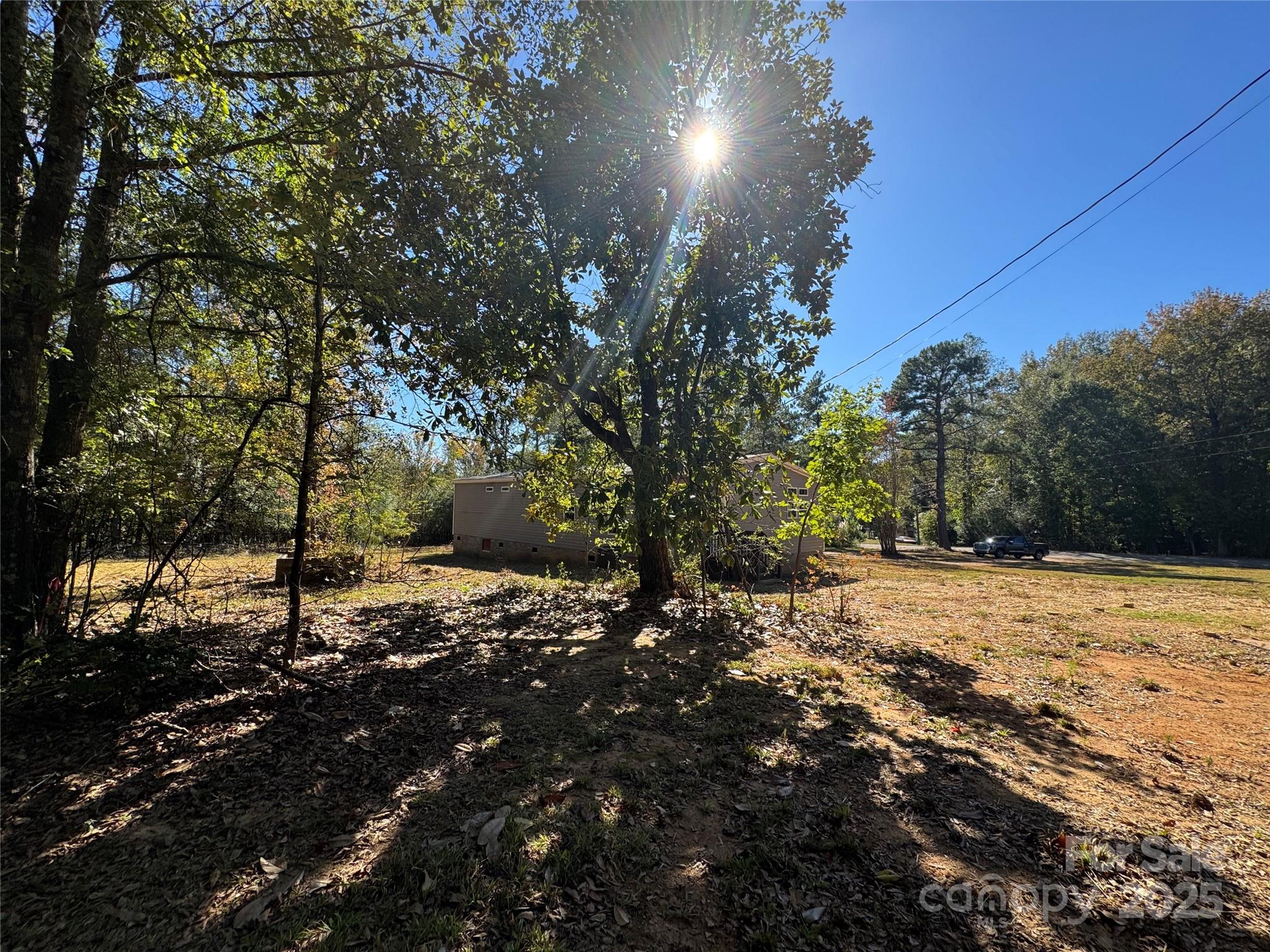 3960 State Rd S-28-414 Kershaw, SC 29067 - Photo 7 of 20 a view of a dirt road with trees in the background