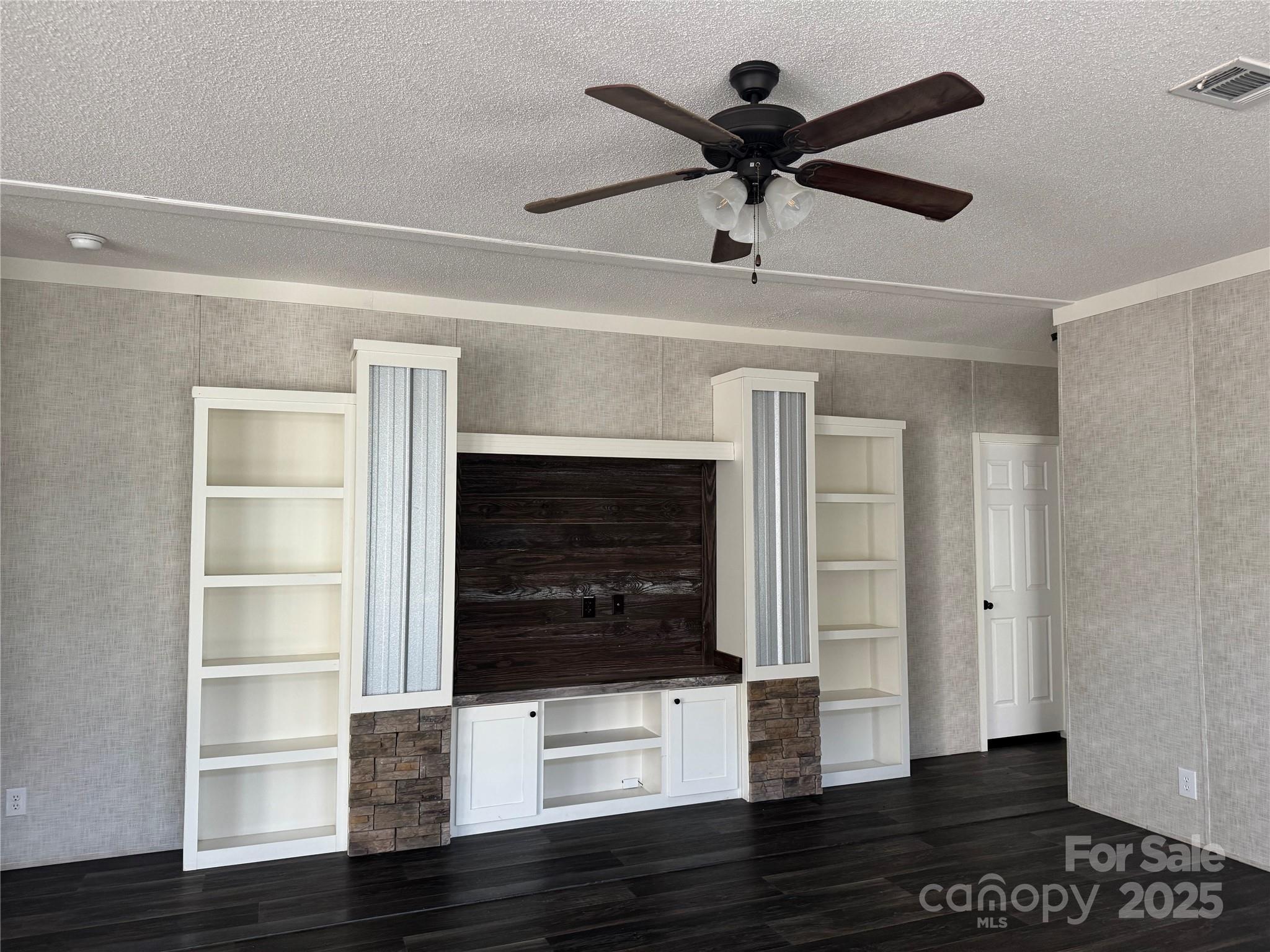 3960 State Rd S-28-414 Kershaw, SC 29067 - Photo 10 of 20 a living room with wooden floor and ceiling fan