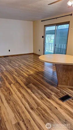 a view of a livingroom with wooden floor
