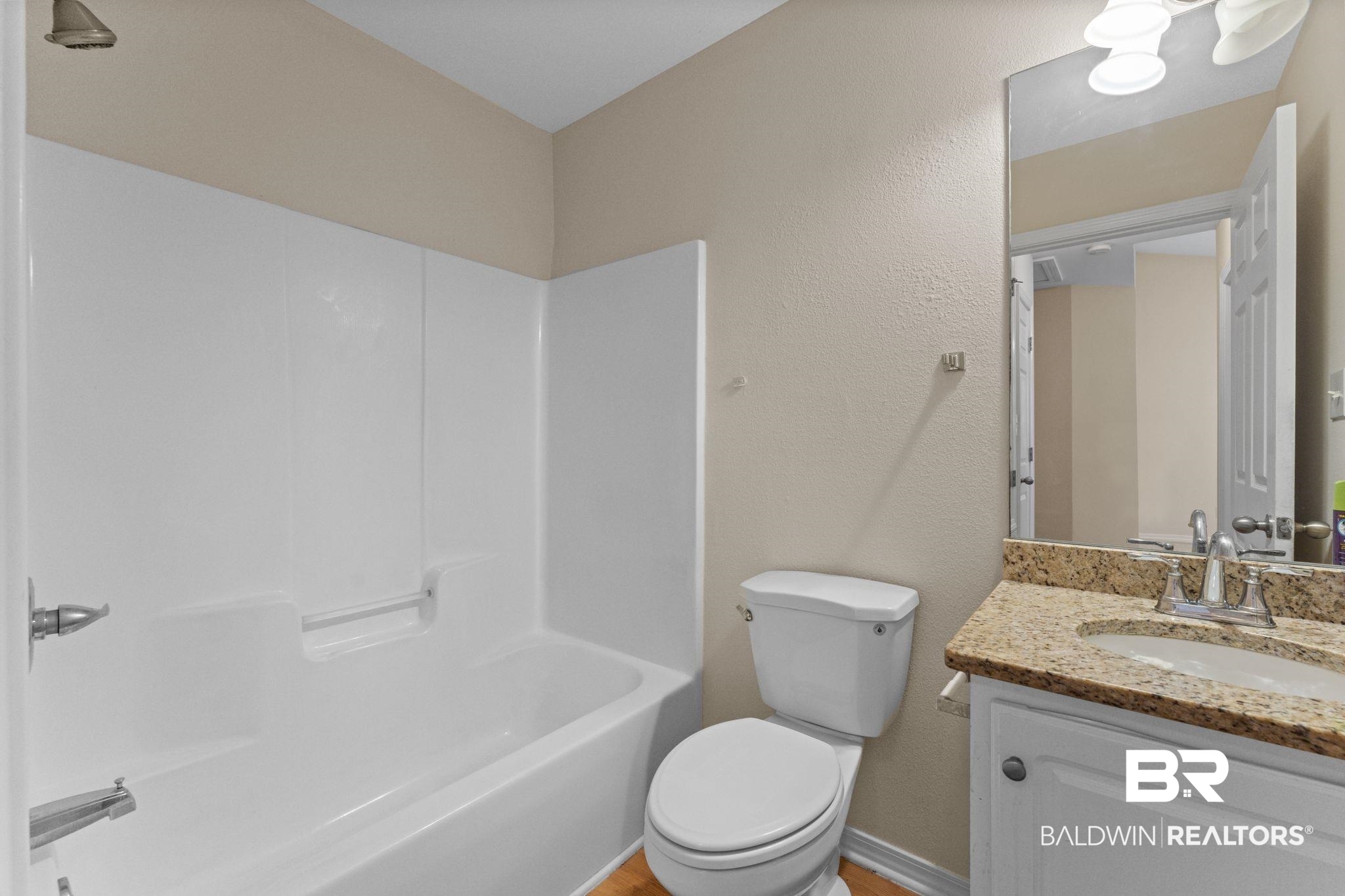 4009 Kendallbrook Loop Foley, AL 36535 - Photo 22 of 28 Bathroom with vanity, shower / bath combination, and a textured wall