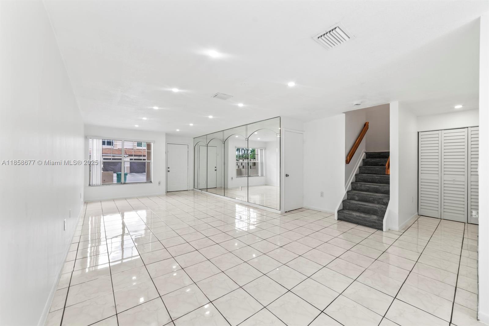 3358 Northwest 198th Terrace Miami Gardens, FL 33056 - Photo 13 of 26 a view of an empty room with stairs and ventilation