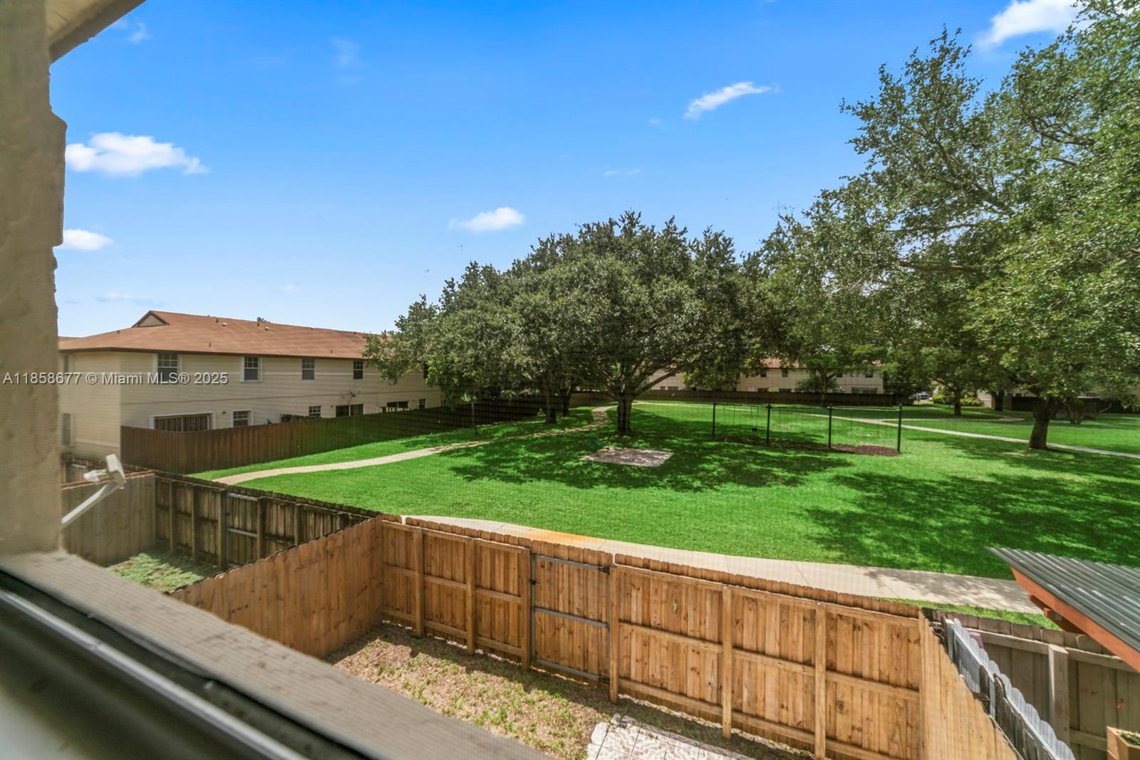 3358 Northwest 198th Terrace Miami Gardens, FL 33056 - Photo 21 of 26 a view of a backyard with a garden and plants