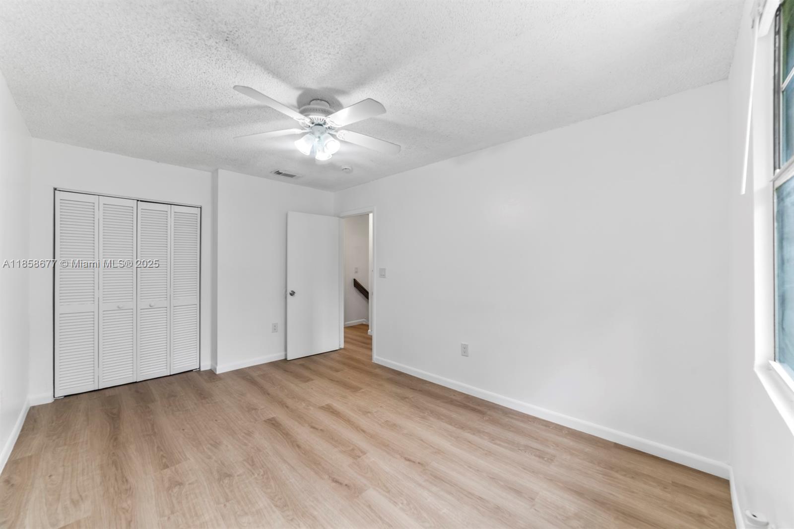 3358 Northwest 198th Terrace Miami Gardens, FL 33056 - Photo 22 of 26 a view of empty room with ceiling fan