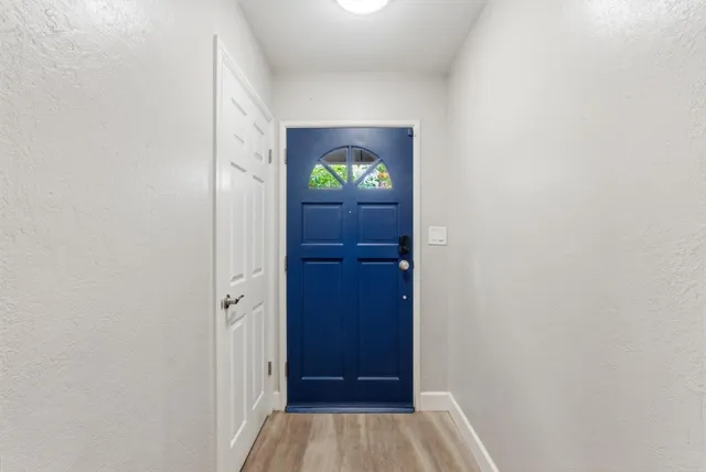 a living room with fireplace furniture and a wooden floor