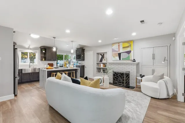 a kitchen with a sink stove and refrigerator