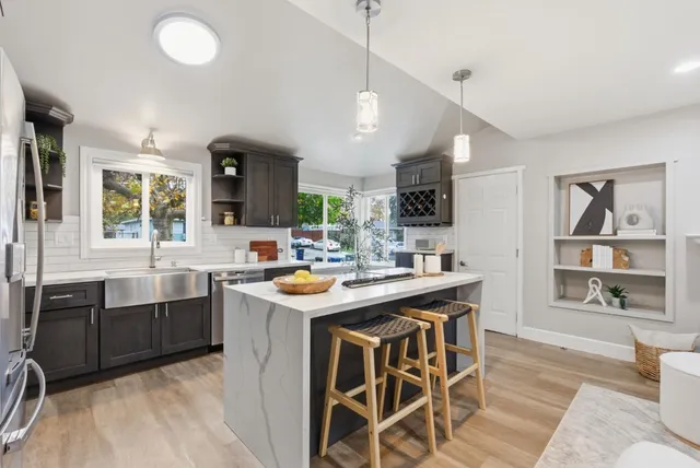 a en suite bathroom with a double vanity sink and a mirror