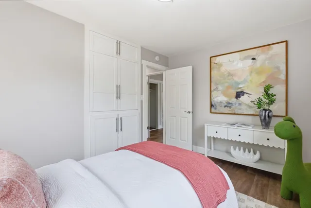 a view of backyard with swimming pool and seating space