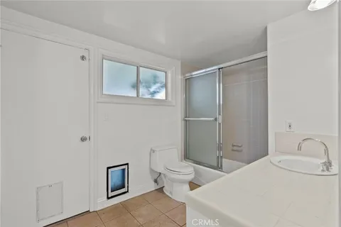 a patio with yard and outdoor seating