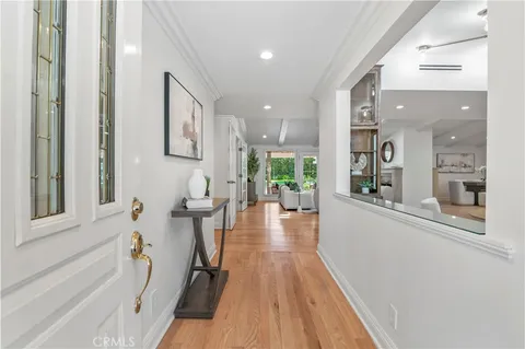 a living room with fireplace furniture and a large window