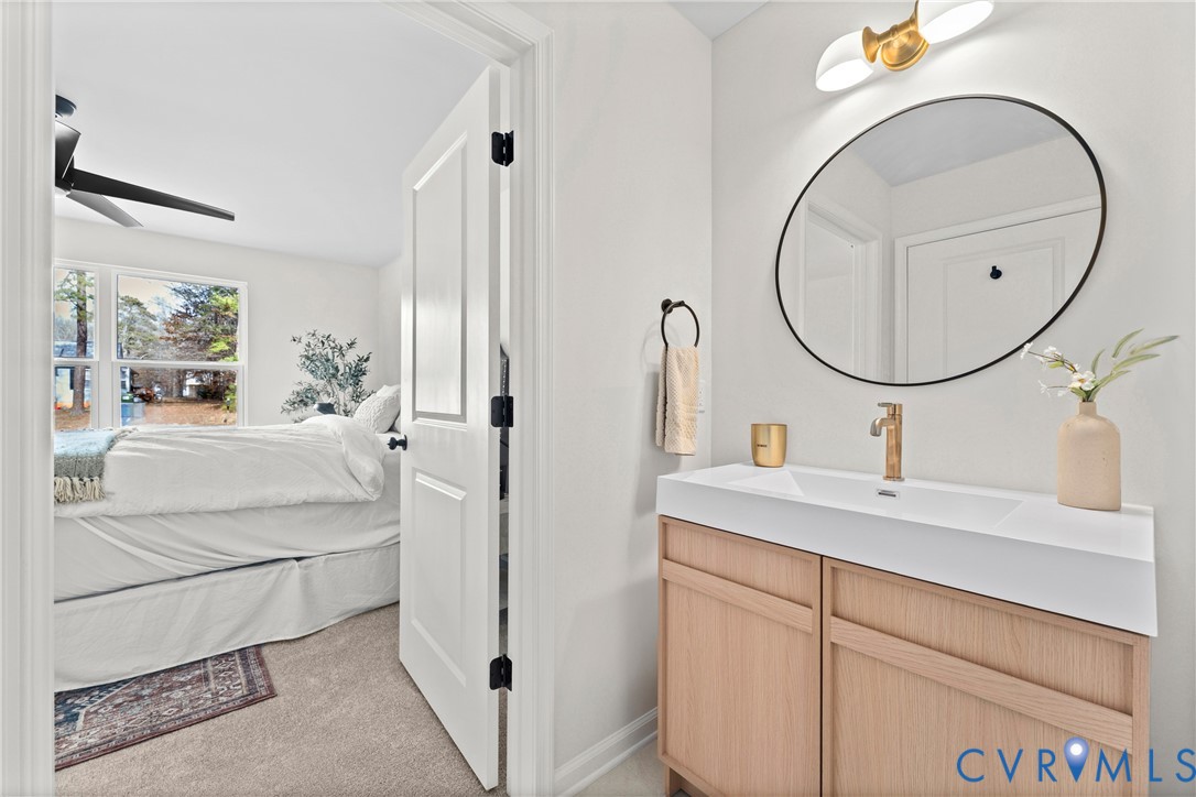 887 Campers Lane Ruther Glen, VA 22546 - Photo 19 of 42 a bathroom with a sink and a mirror