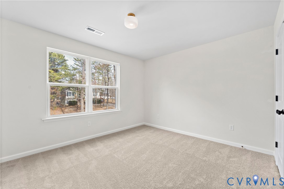 887 Campers Lane Ruther Glen, VA 22546 - Photo 29 of 42 an empty room with a window