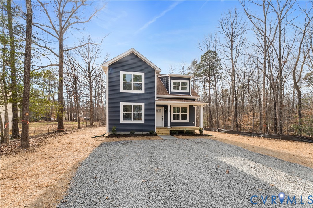 887 Campers Lane Ruther Glen, VA 22546 - Photo 35 of 42 a view of a house with a large tree in front of it
