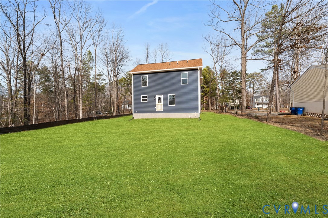 887 Campers Lane Ruther Glen, VA 22546 - Photo 36 of 42 a view of a house with a yard