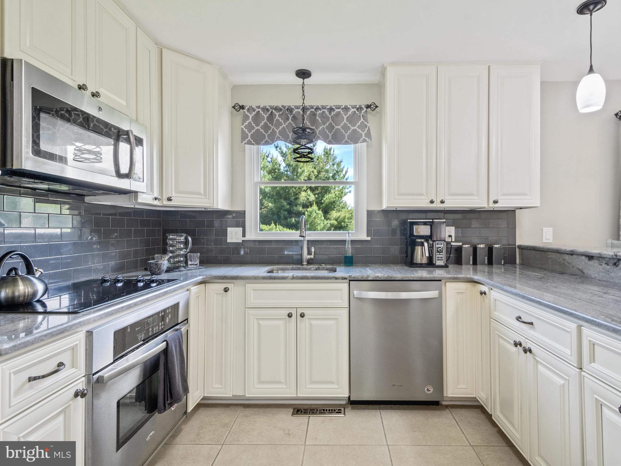 6627 Wind Ridge Road Mount Airy, MD 21771 - Photo 12 of 33 Renovated Kitchen with Fresh White Cabinets
