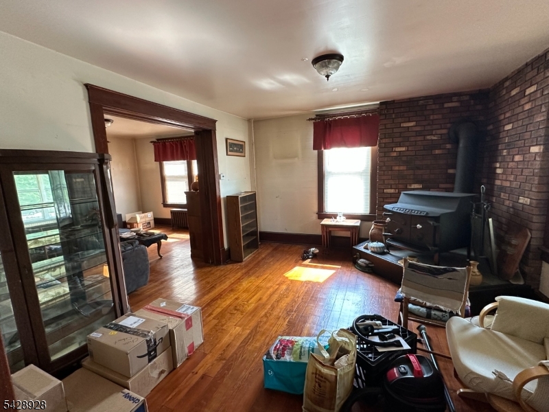 13 Cemetery Road Great Meadows, NJ 07838 - Photo 9 of 20 a living room with furniture and a flat screen tv