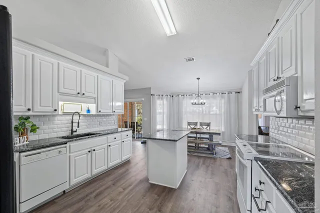 a bathroom with a double vanity sink mirror and