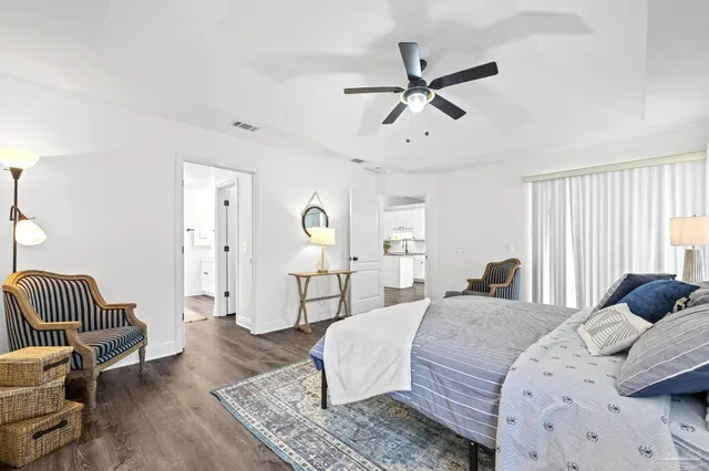 a view of a bedroom with furniture and a window