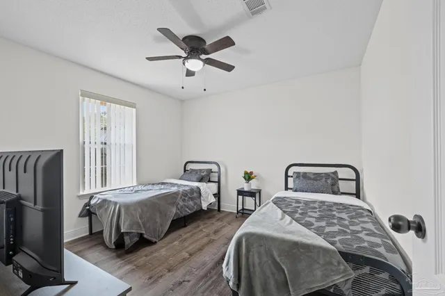 a bed room with a bed and a window