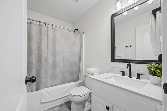 a view of a dining room with furniture and front door