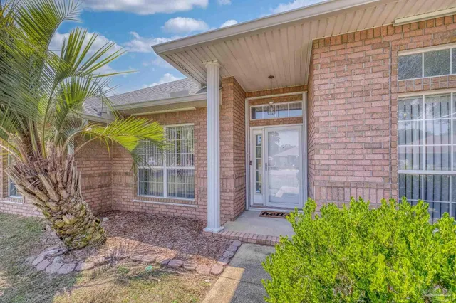 a view of a hallway view with wooden floor and staircase