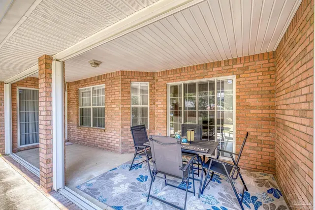 a front view of house with yard and trees