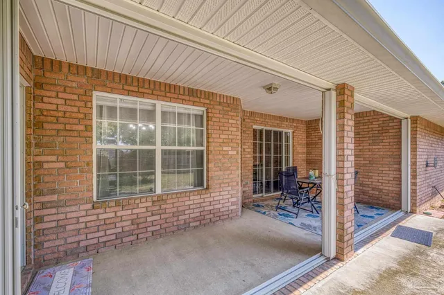 a front view of a house with a garden and deck