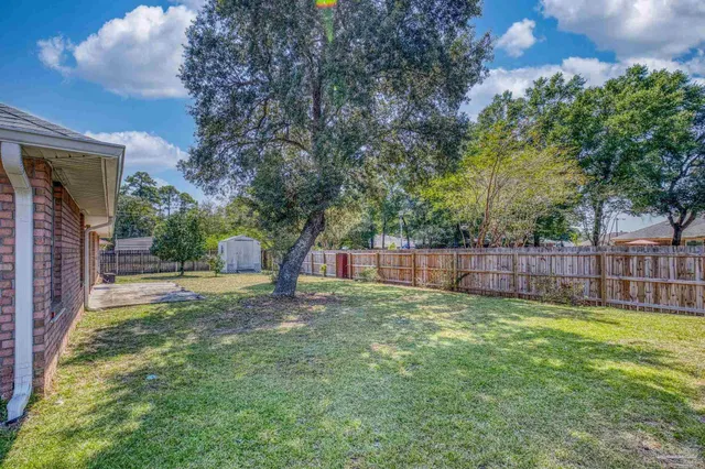 an aerial view of a house with a garden