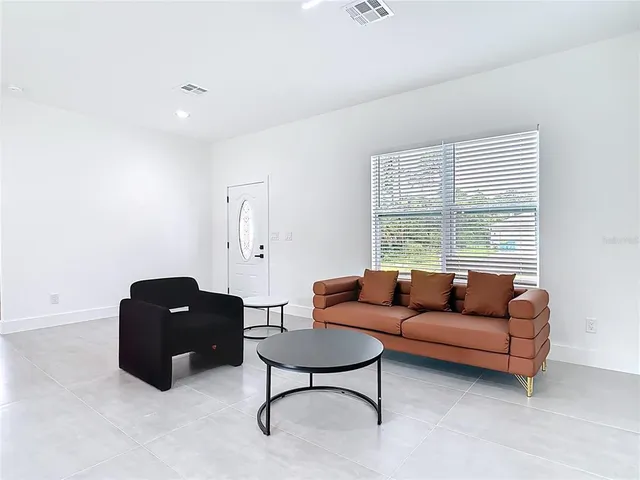 a living room with furniture and a window