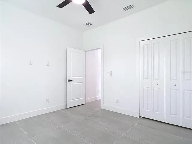 an empty room with fan