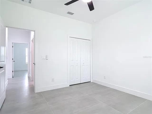 an empty room with view of bathroom