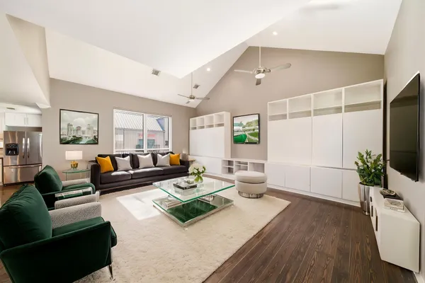 a living room with furniture and a large window