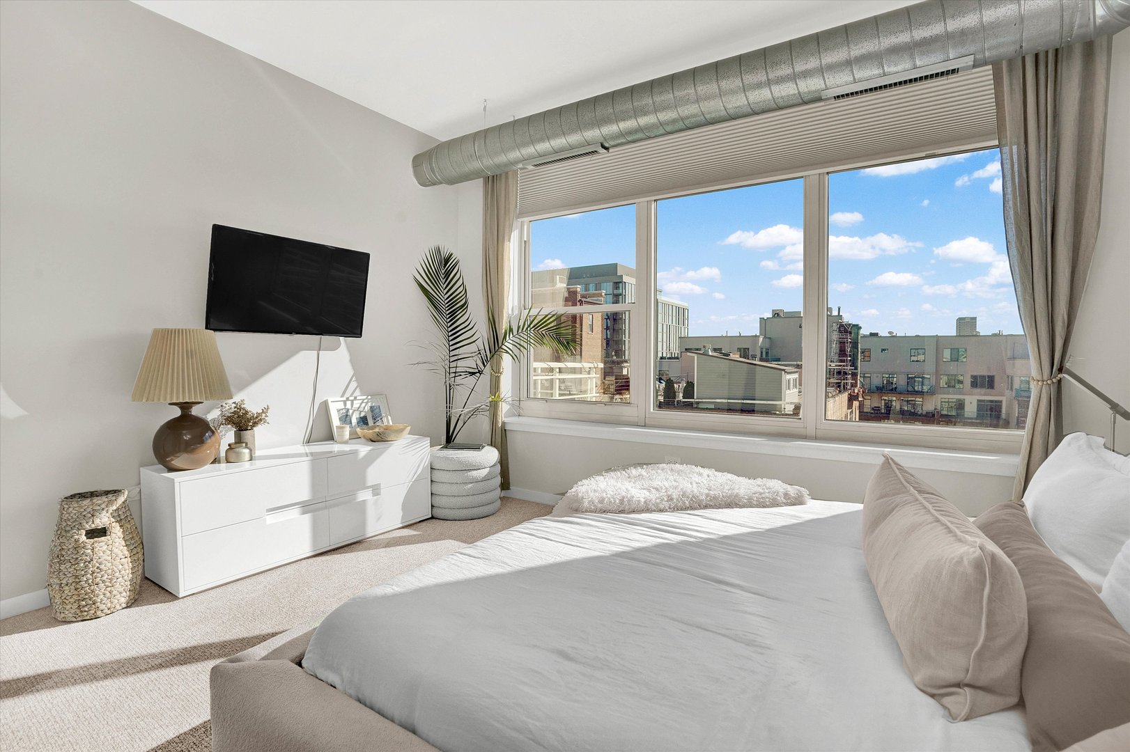 909 West Washington Boulevard, Unit 1002 Chicago, IL 60607 - Photo 12 of 15 a living room with furniture and a flat screen tv