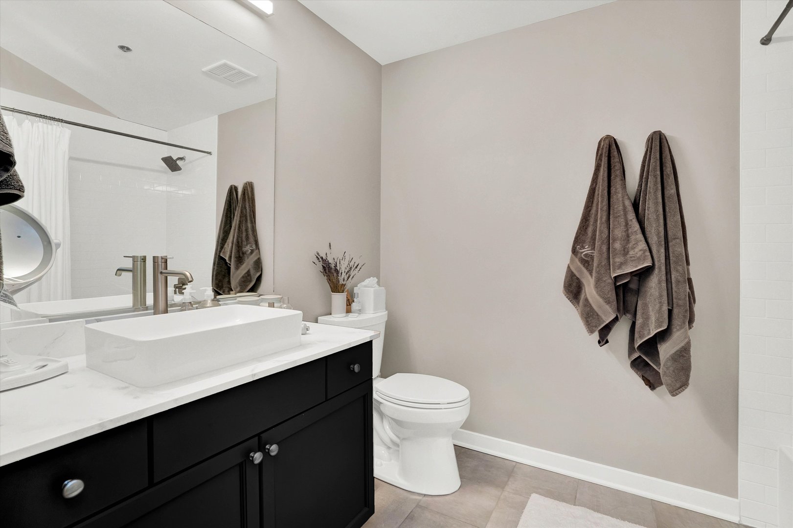 909 West Washington Boulevard, Unit 1002 Chicago, IL 60607 - Photo 13 of 15 a bathroom with a sink vanity and toilet
