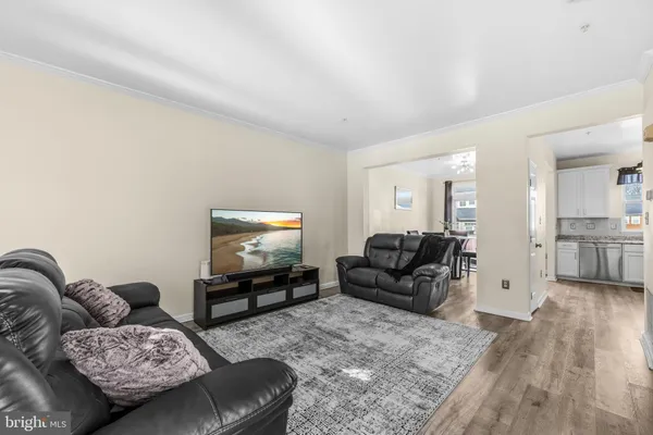 a kitchen with stainless steel appliances granite countertop a stove a refrigerator and a sink