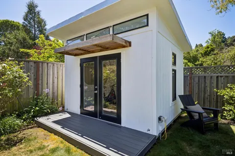 a view of backyard with furniture and garden