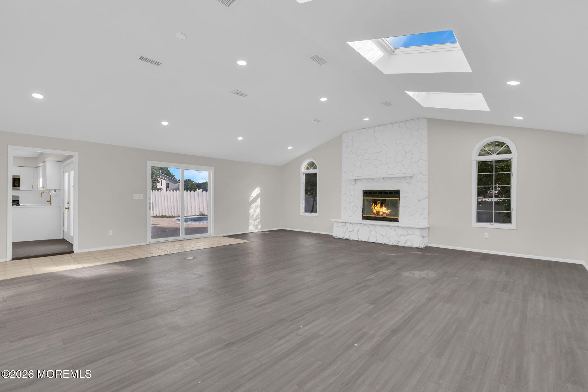 45 Peachstone Road Howell, NJ 07731 - Photo 19 of 54 an empty room with wooden floor and windows