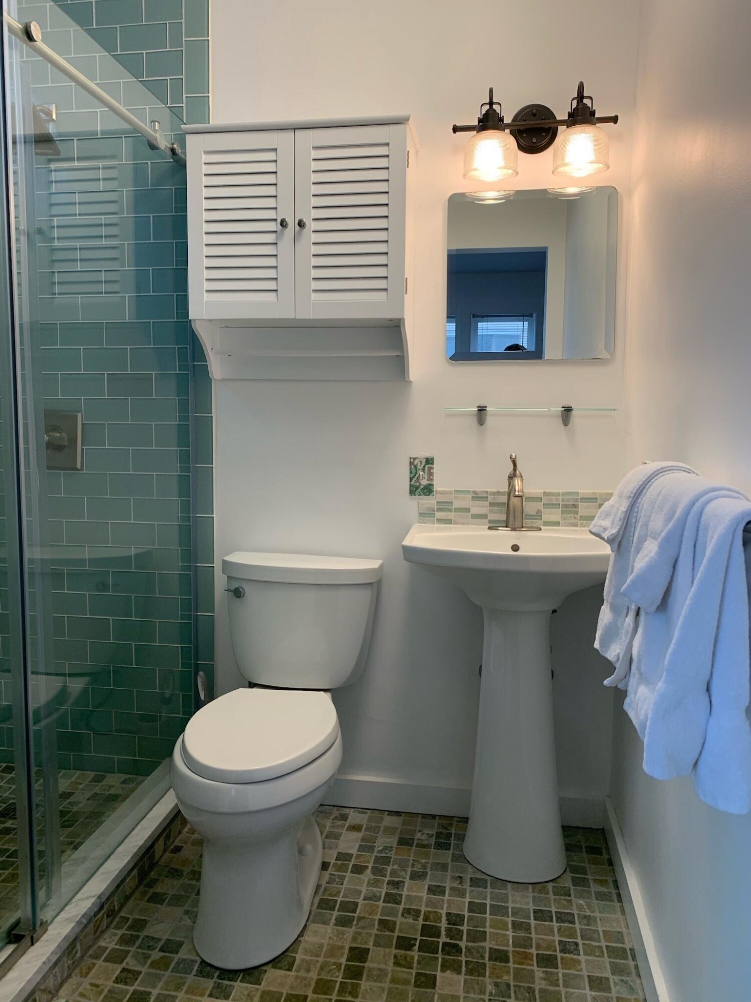 495 Commercial Street, Unit U11 Provincetown, MA 02657 - Photo 22 of 29 a bathroom with a sink toilet and shower
