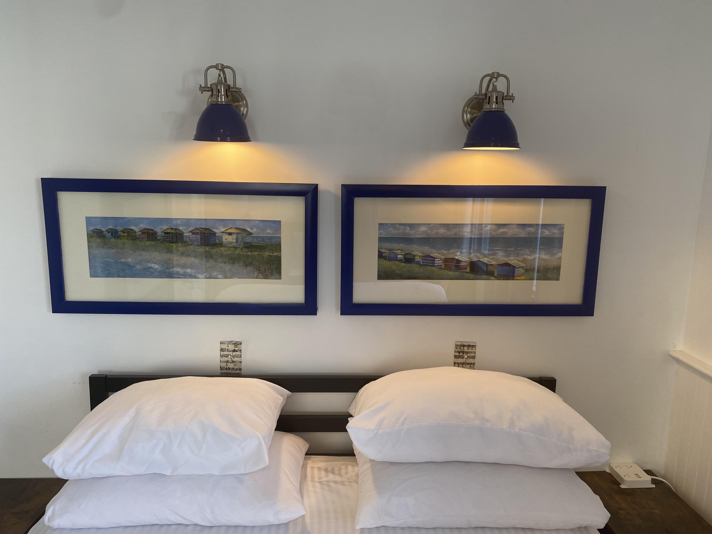 495 Commercial Street, Unit U11 Provincetown, MA 02657 - Photo 26 of 29 a view of a bedroom with furniture and lamp