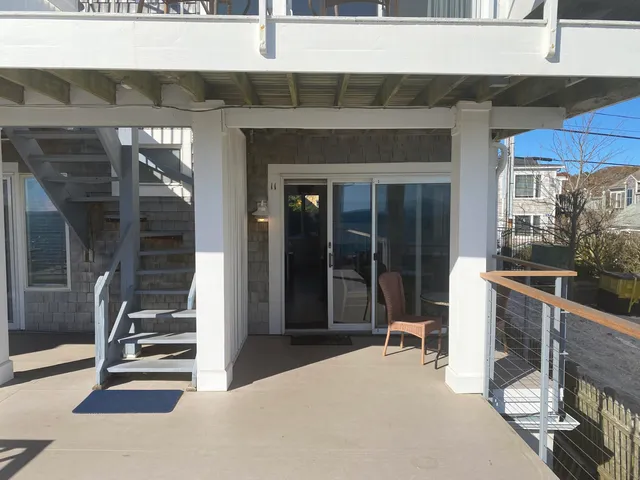 a room with lots of windows and a glass door