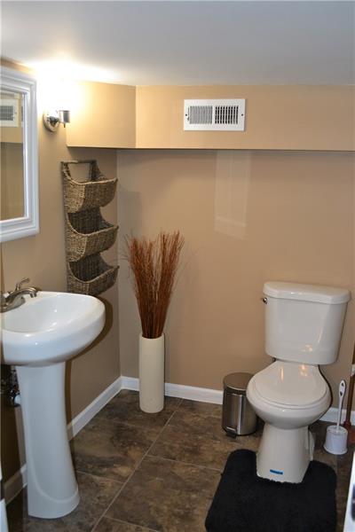 342 Service Way Pittsburgh, PA 15201 - Photo 21 of 23 FULLY UPDATED HALF BATH, LOCATED IN THE PARTIALLY FINISHED BASEMENT AREA