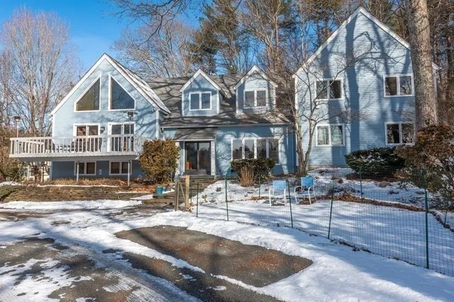 a view of a big house with large windows