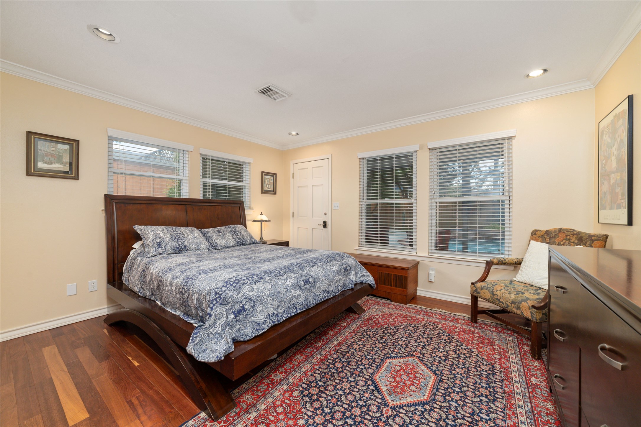 1613 California Street Houston, TX 77006 - Photo 47 of 50 Guest Cottage:
The spacious bedroom offers warm wood floors, abundant natural light, and a generous walk-in closet (not pictured), creating a comfortable retreat for overnight guests or extended stays. More than one guest described the cottage as feeling like "our second home."