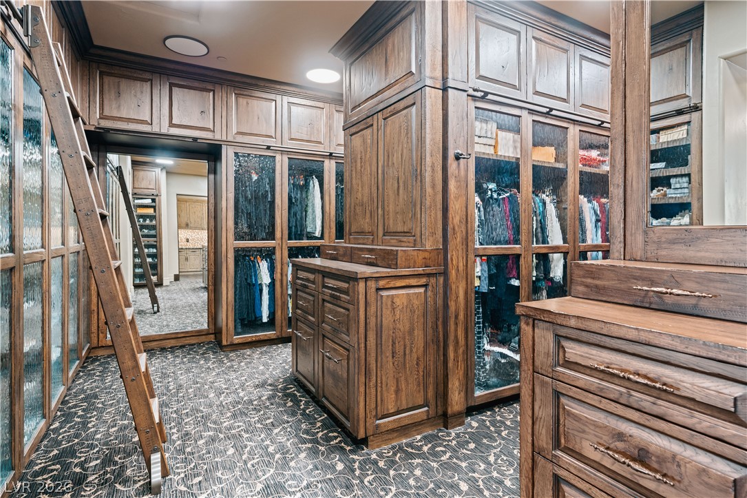 1123 Christian Road Henderson, NV 89002 - Photo 29 of 94 Custom cabinetry and abundant storage define this luxurious, well-appointed dressing room.
